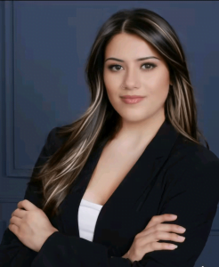 Confident real estate professional standing with arms crossed, representing expertise in helping homeowners understand how foreclosures work.